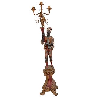 BLACKAMOORE, FRANCIA, S.XX. Elaborado en madera policromada y latón dorado. Diseño a manera de moretto veneciano sobre pedestal.