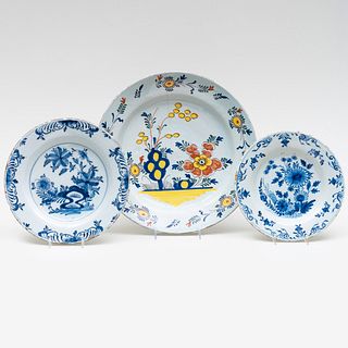 Two Delft Blue and White Plates and a Polychrome Charger