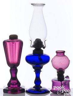 Three glass fluid lamps, 19th c.