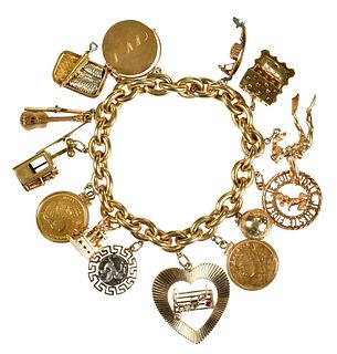 18kt. Gold Charm Bracelet with 15 Charms