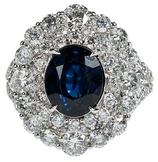 18kt. Blue Sapphire and Diamond Halo Ring