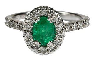 14kt. Emerald and Diamond Halo Ring