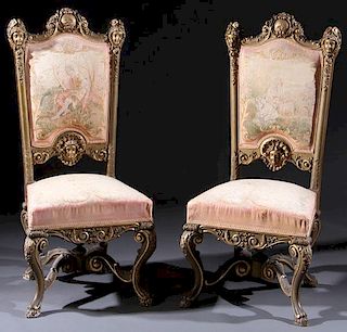 A PAIR OF ITALIANATE CARVED GILT WOOD ARM CHAIRS