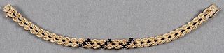 A LADIES 14K YELLOW GOLD AND SAPPHIRE BRACELET