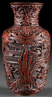 A CHINESE CARVED CINNABAR AND BRONZE SCENIC VASE