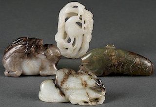 A GROUP OF FOUR CHINESE CARVED JADE ORNAMENTS