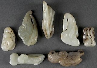 A GROUP OF SEVEN CHINESE CARVED JADE ORNAMENTS