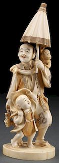 A JAPANESE CARVED IVORY OKIMONO OF AN ENTERTAINER