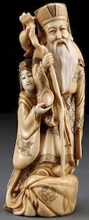 A JAPANESE CARVED IVORY OKIMONO OF AN IMMORTAL, M