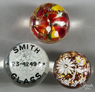 Group of six assorted paperweights.