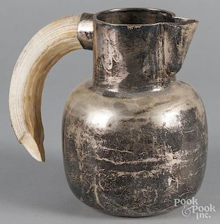 silver plate pitcher by Cuheman, with horn handle, 9 1/2'' h., together with three gilt metal eagles,