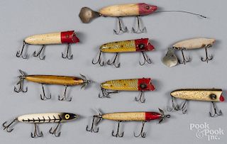 Nine Heddon wood fishing lures, to include three Torpedo's, two flaptails, and four Lucky 13, longes