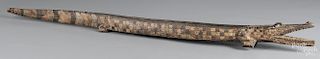 Large carved and painted crocodile, early 20th c., 71'' l.