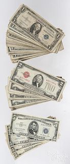 Forty-one two dollar US notes with red seals, forty-one dollar silver certificates, and five 5 dolla