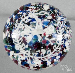 White frit paperweight, with a multicolored chip ground, inscribed Mary, 3'' dia.