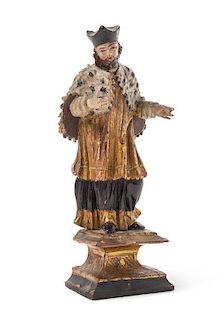 * An Austrian Painted and Parcel Gilt Carved Wood Figure Height 9 inches.