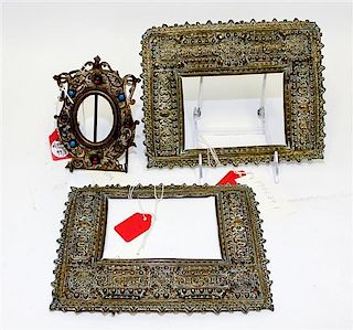 * A Pair of Spanish Baroque Style Pressed Brass Frames Each 7 x 8 7/8 inches.