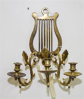 * A Neoclassical Style Brass Three-Light Sconce Height of sconce 13 1/4 inches.