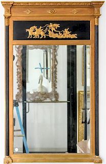 * An Empire Style Ebonized and Parcel Gilt Mirror Height 52 x width 32 inches.