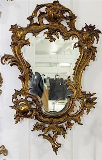 * A Louis XV Style Gilt Bronze Mirror Height 32 x width 20 1/2 inches.