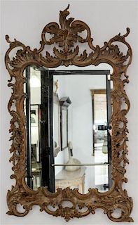 * A Louis XVI Style Carved Pier Mirror Height 57 1/4 x width 35 1/2 inches.