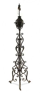 * A Wrought Iron Posset Cup Holder Height 69 inches.