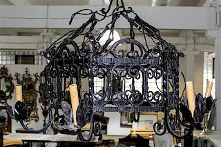 * Two Wrought Iron Light Fixtures Diameter of largest 30 1/2 inches.