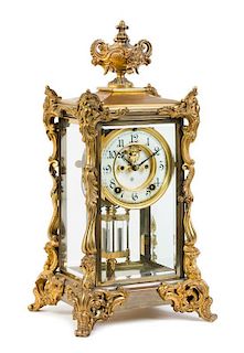 A Louis XV Style Gilt Metal Regulator Mantel Clock Height 15 7/8 inches.