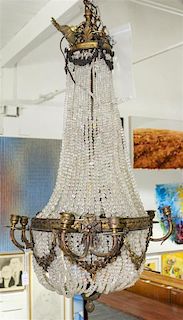 A Continental Cast Metal Chandelier Height 36 inches.