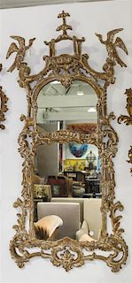 A Rococo Style Simulated Limed Wood Mirror Height 67 inches.