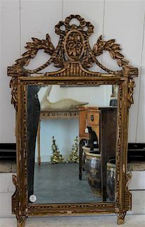 A Louis XV Style Giltwood Mirror. Height 32 inches.