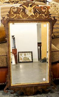 * A Chippendale Style Parcel Gilt Mahogany Mirror Height 40 1/2 x width 22 1/2 inches.