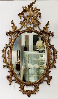 * A Chippendale Style Giltwood Mirror Height 45 x width 26 inches.
