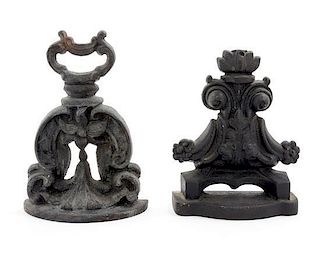 Two Cast Iron Doorstops Height of tallest 9 1/4 inches.