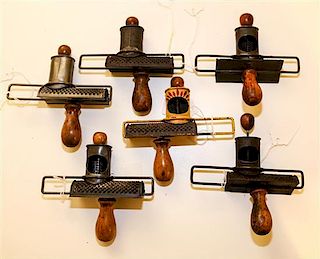 A Collection of Nutmeg Graters Length 5 3/8 inches.
