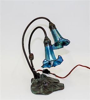 A Bronze and Glass Lamp Height 11 3/4 inches.
