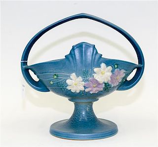 * A Roseville Pottery Basket Height over handle 12 inches.