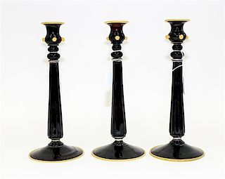 A Group of Three Murano Glass Candlesticks Height 11 5/8 inches.