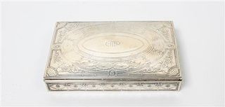 * An American Silver Cigarette Box, Tiffany & Co., New York, NY, Circa 1913-1914, of rectangular form with incised scrolling 