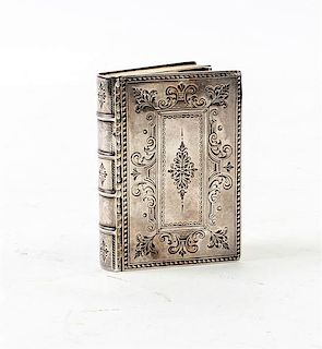 * A Silver Snuff Box, , in the form of a book with floral and volute chased covers.