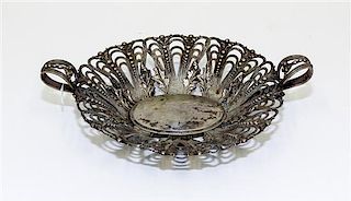 A Continental Silver Centerpiece Basket, , having open work decoration with foliate and bead motifs throughout.