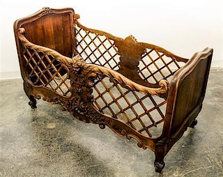 * A French Carved Wood Crib Height 37 3/4 x width 60 x depth 31 1/4 inches.