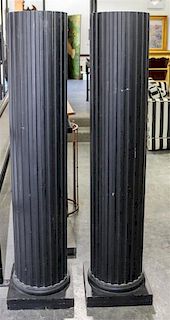 A Pair of Ebonized Pedestals Height 60 inches.