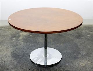 A Circular Danish Teak and Chrome Occasional Table Height 19 3/4 x diameter 29 3/4 inches.