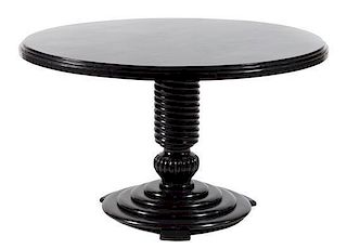 * An Ebonized Occasional Table Height 28 1/2 inches.