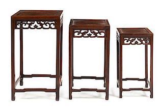 * A Set of Three Chinese Hardwood Nesting Tables Height of tallest 26 x width 15 x depth 15 inches.