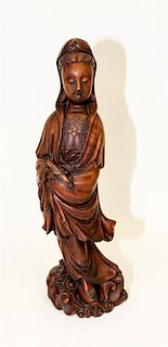 * A Chinese Carved Wood Figure of Guanyin Height 17 1/4 inches.