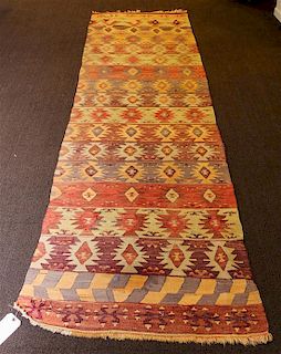 A Kilim Flatweave Wool Rug 11 feet 4 inches x 2 feet 9 inches.