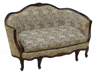 CURVED BACK SETTEE WITH FLORAL UPHOLSTERY