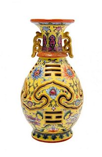 A Chinese Polychrome Enamel Porcelain Revolving Vase, Height 8 3/16 inches.